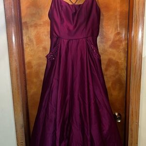 Burgundy gown.